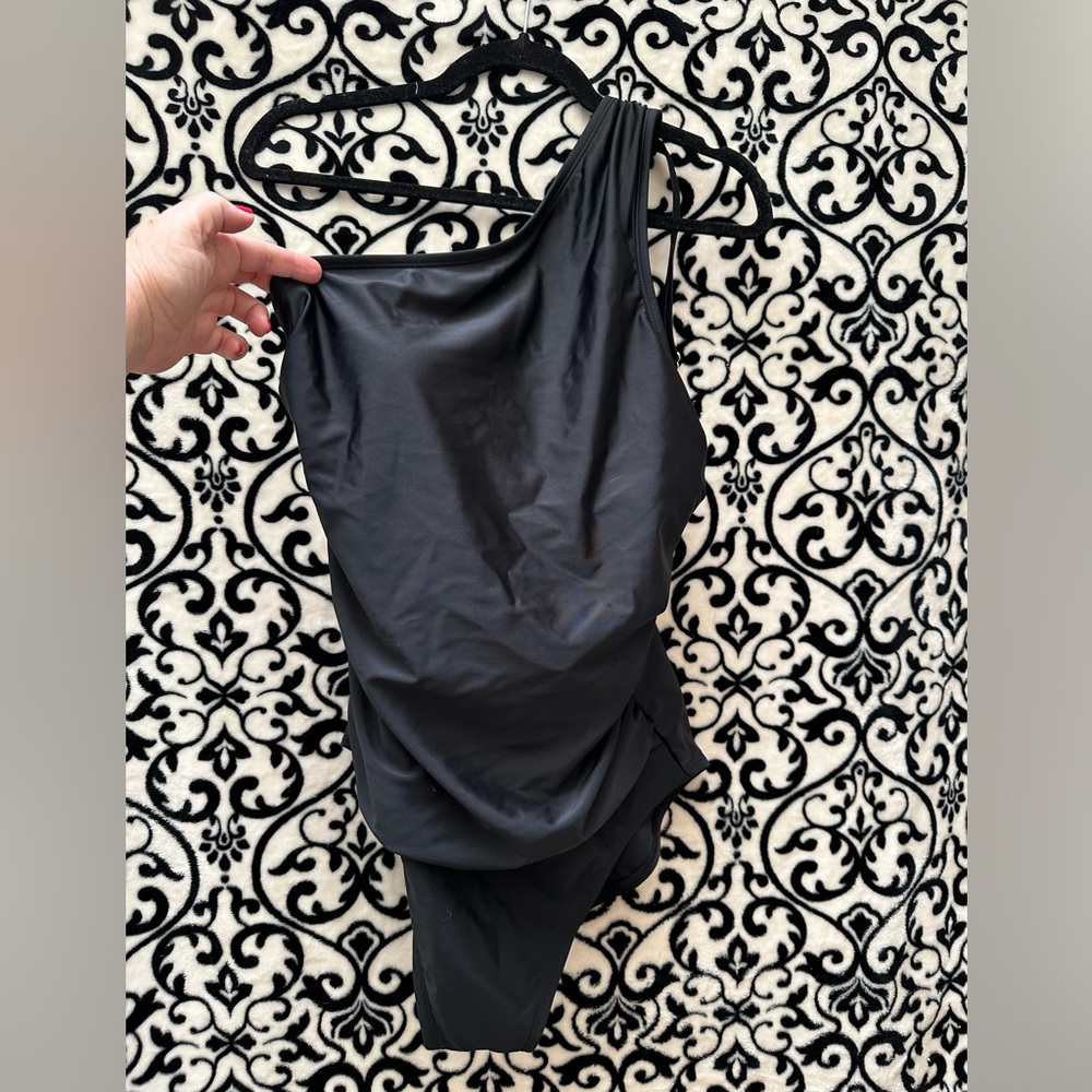 Sassy black one shoulder one piece swimsuit.  Adjustable shoulder strap. NWT